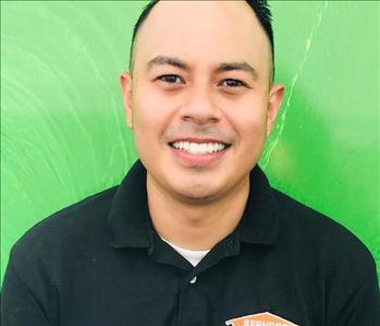 This image shows a male SERVPRO employee