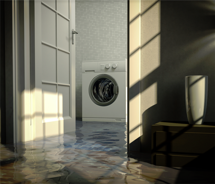 a flooded laundry room with water everywhere