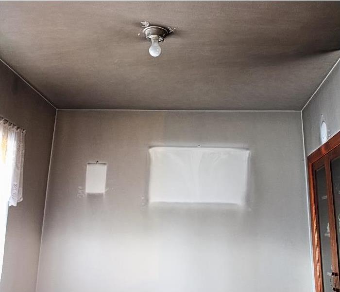 smoke and soot damage on wall and ceiling